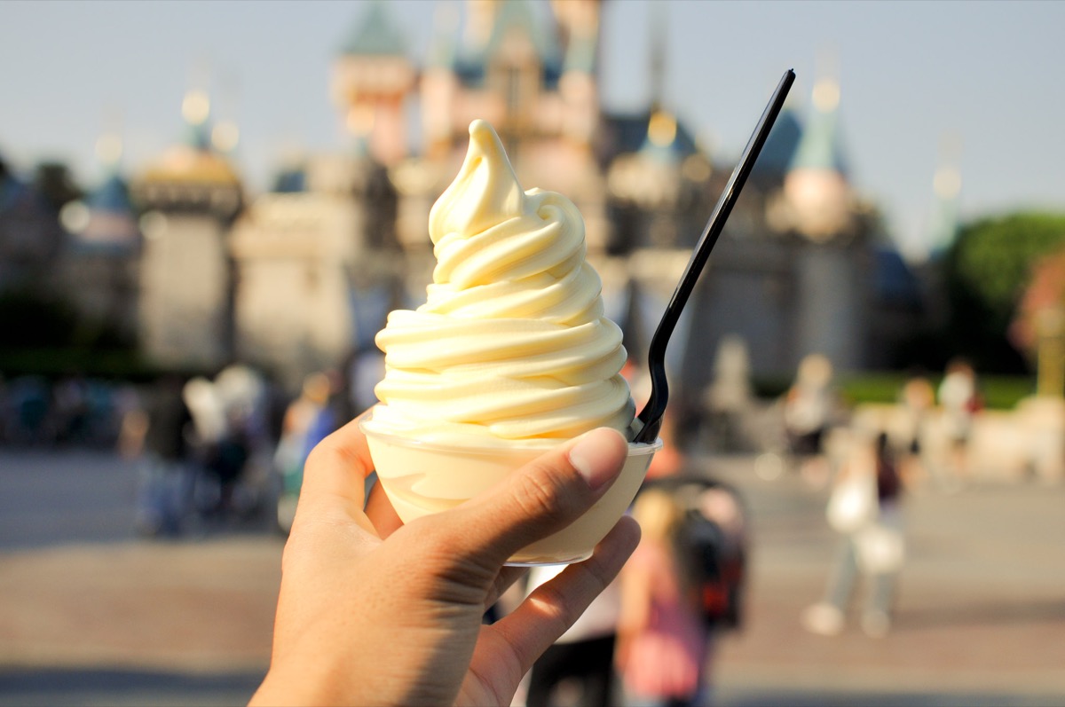 dole whip with castle background in disney world