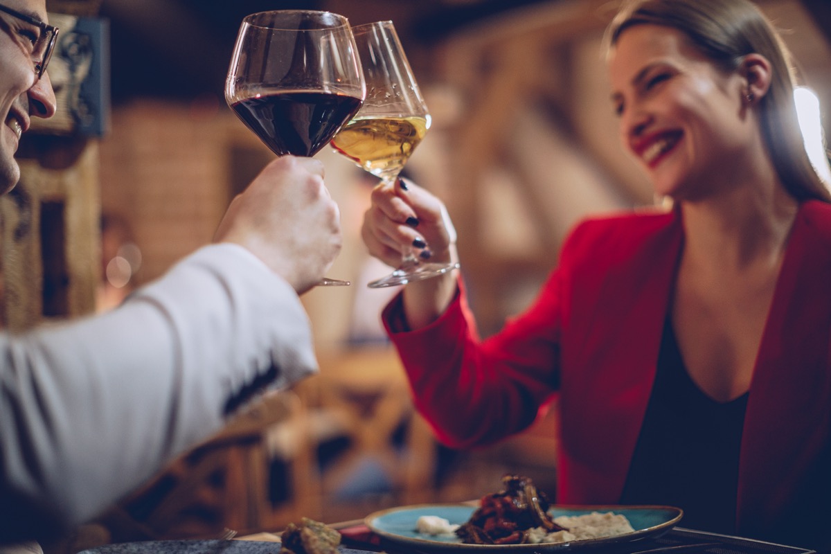 Sweet couple having a romantic dinner with wine