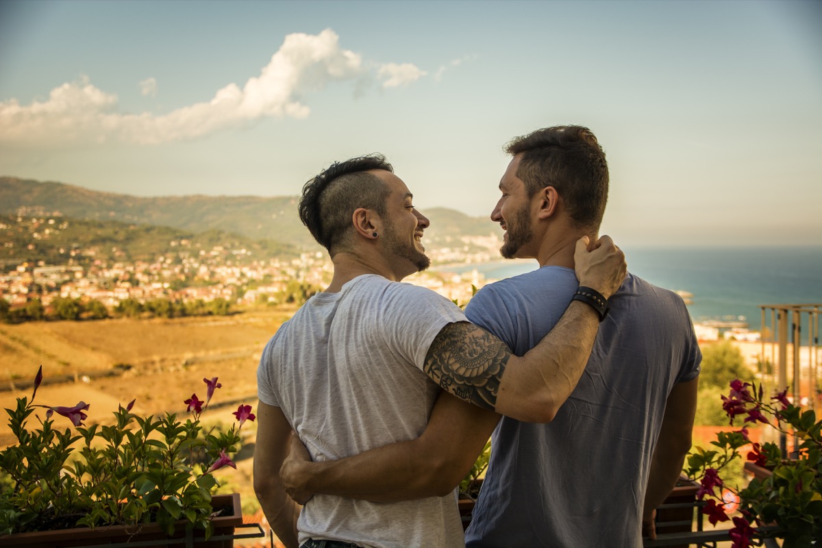 Gay couple hiking on vacation