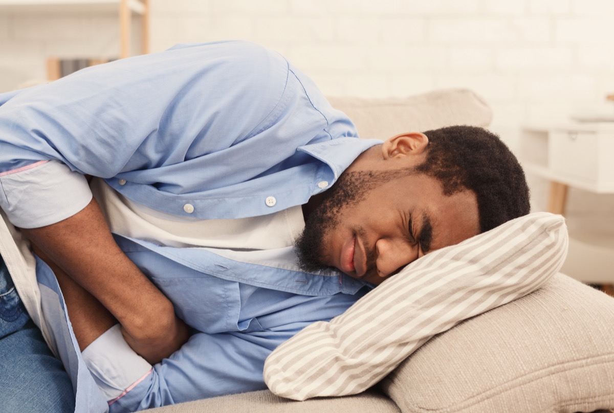 Man suffering from stomach ache nauseous