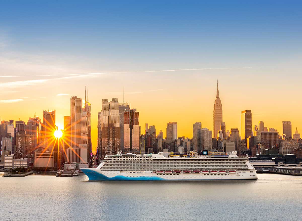 cruise ship in new york city harbor at sunset