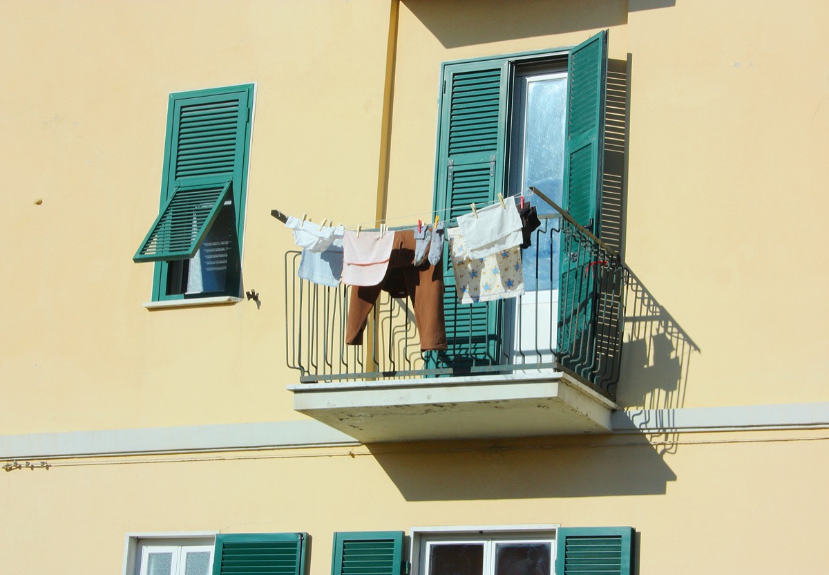 clothes being hang on a balcony