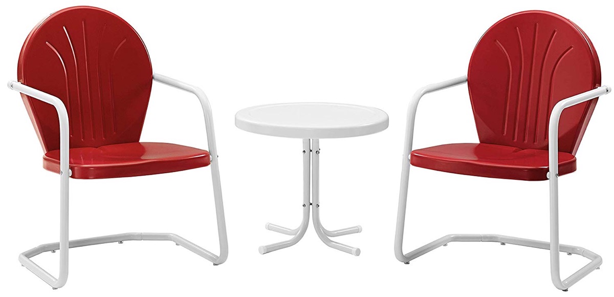 two red outdoor chairs and white table
