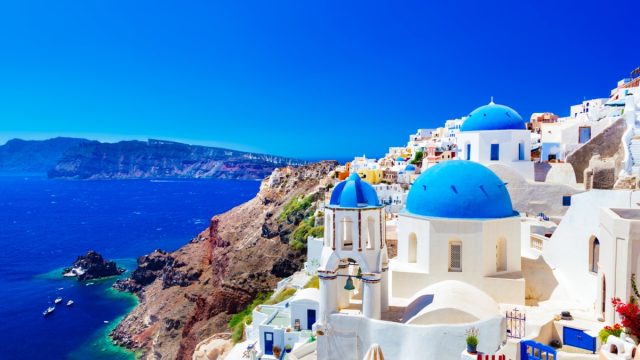 the famous blue-roof houses on santorini island greece