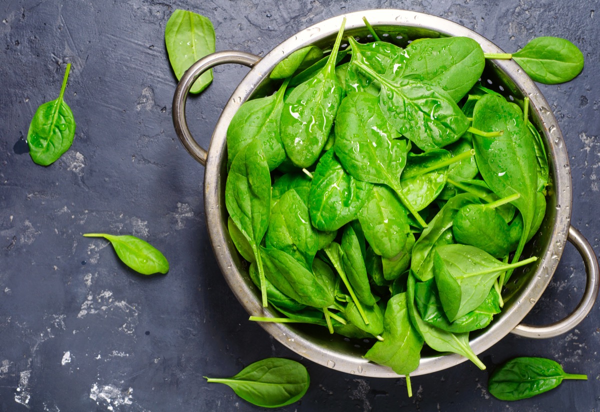 A bowl of freshly washed spinach leaves