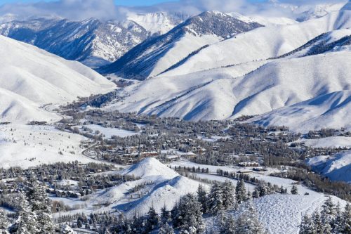 aerial view of sun valley resort in idaho in the winter with snowcapped mountains