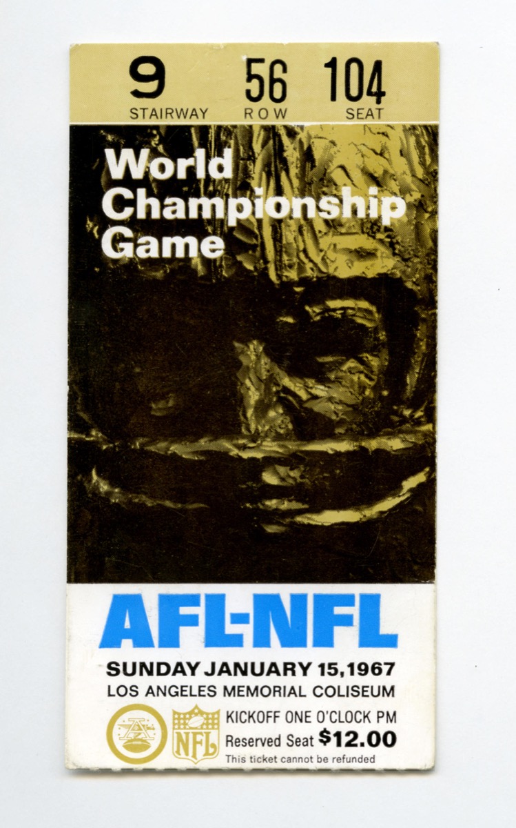 Souvenir ticket stub for the very first Super Bowl game that was held at the Los Angeles Memorial Coliseum in 1967 and was called the AFL-NFL World Championship Game between the Green Bay Packers and the Kansas City Chiefs.