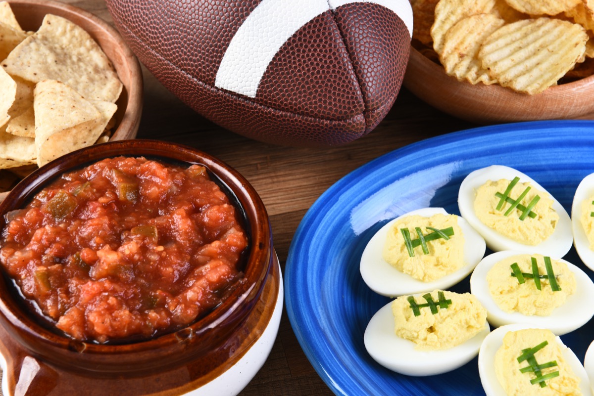 Chips, salsa, and deviled eggs laid out for Super Bowl
