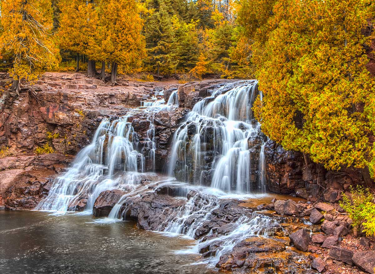 waterfall surrounded by fall foliage