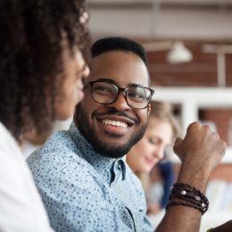 young black man smiling at woman