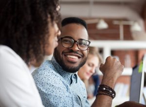young black man smiling at woman