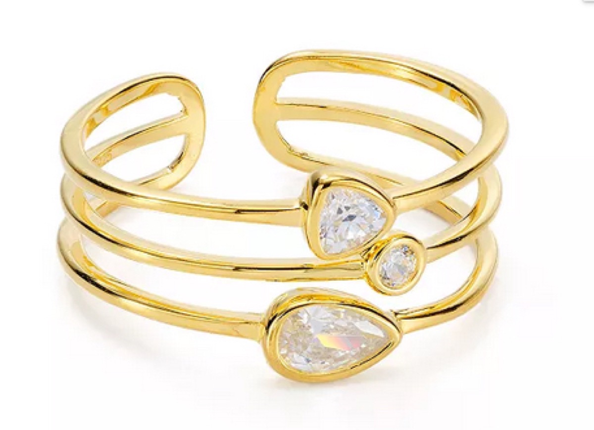gold triple ring with white stones
