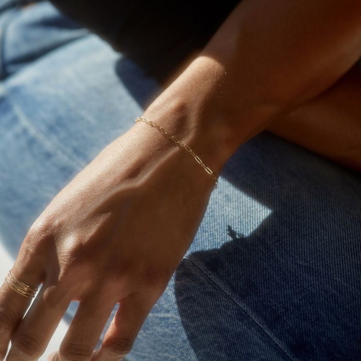 white wrist with gold bracelet