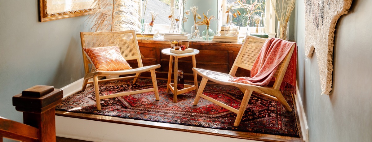 modern living room with kilim and two chairs