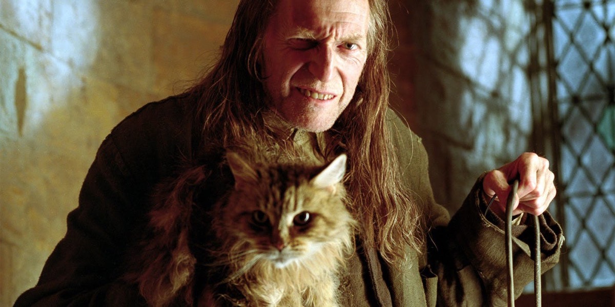 Argus Filch and Mrs. Norris in Harry Potter