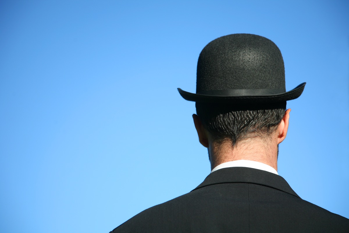 head shot from behind of man with bowler hat