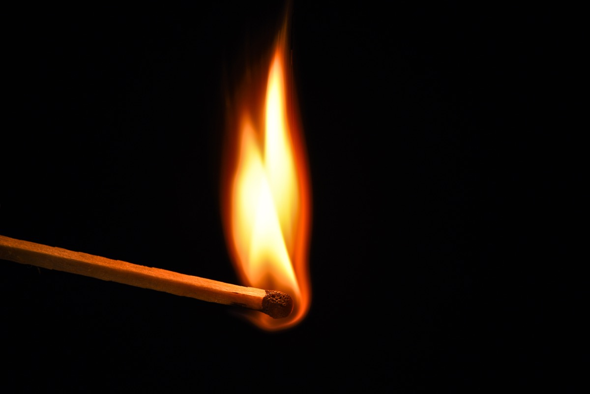 fire burning on a matchstick