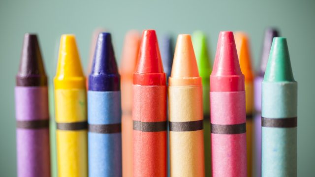 close up view of an assortment of crayons pointed up