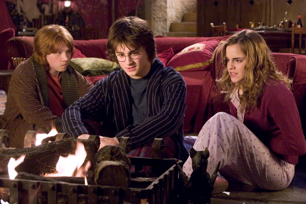 Harry Ron and Hermione in the Gryffindor common room