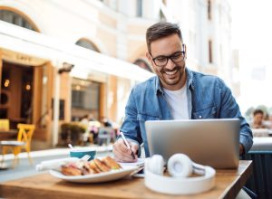 modern young student learning on line at the coffeehouse