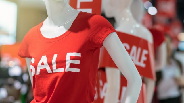 mannequin in red t-shirt with "sale" on it