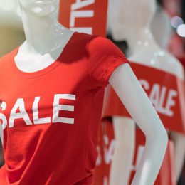mannequin in red t-shirt with "sale" on it