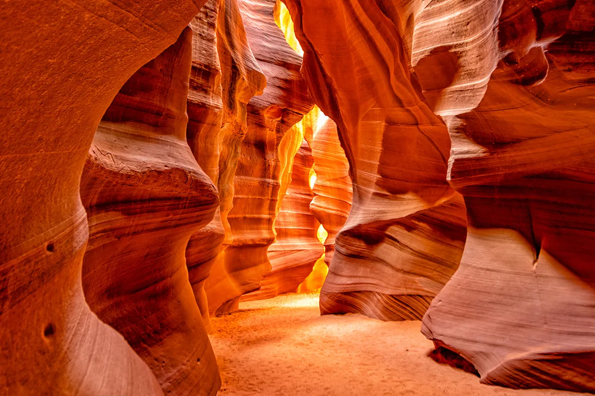 antelope canyon lit by the sunrise 