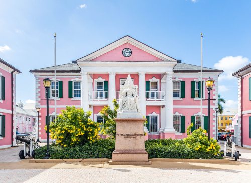 NASSAU, BAHAMAS - OCTOBER 13, 2019: Parliament Square is a group of government buildings that were built in 1815. The buildings are painted in a flamingo pink and are modeled after New Bern, NC.