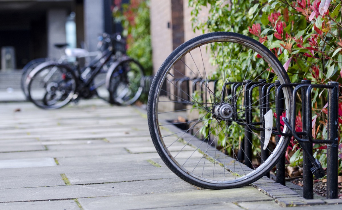 bike wheel attached to bike rack after bike is stolen
