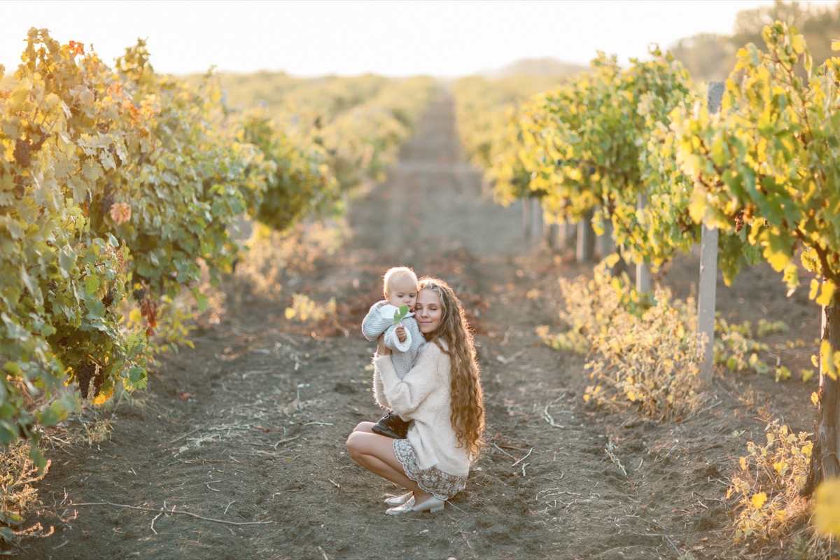 Mom in vineyard with child