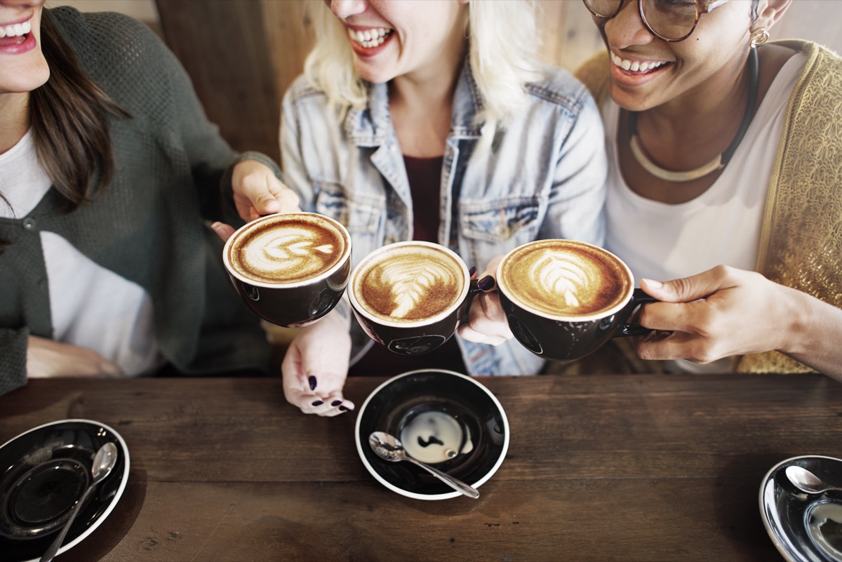 Women drinking coffee together at a coffee shop