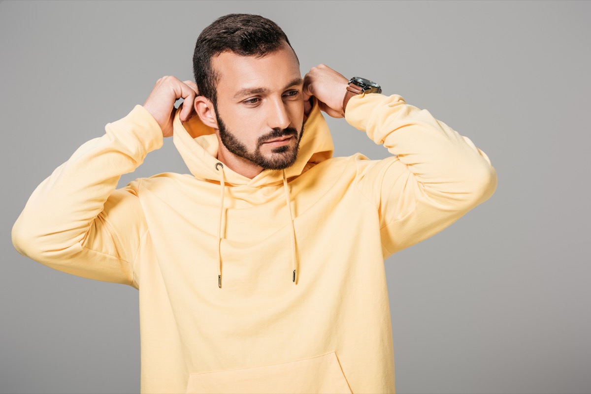 Man wearing a yellow hoodie