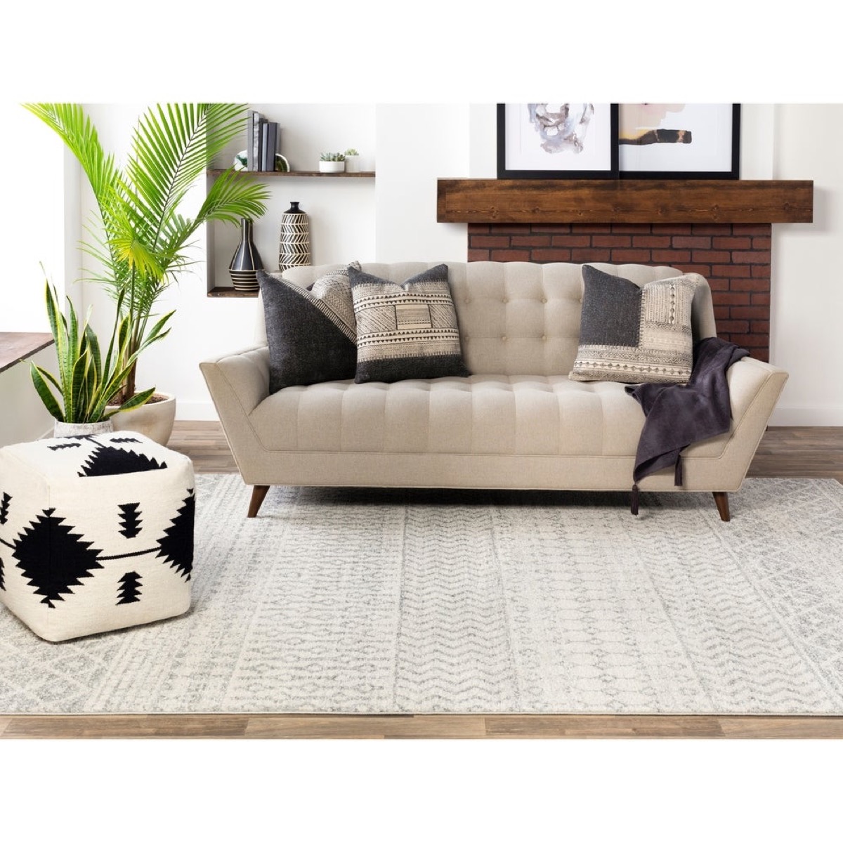 Boho room with gray rug and sofa