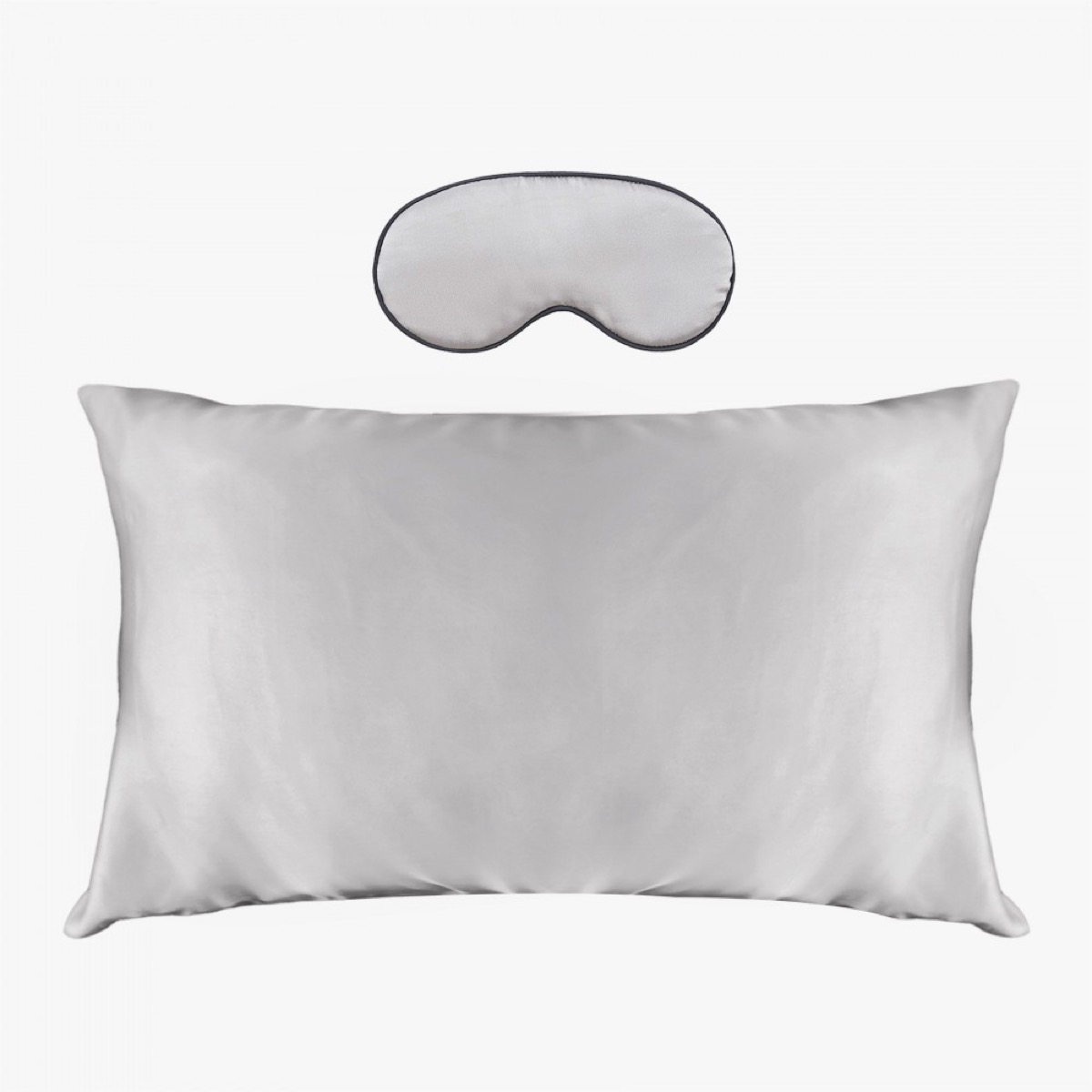 Silver silk pillowcase and eye mask, white background
