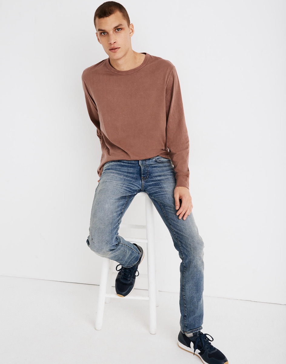 Man wearing jeans and long sleeve top