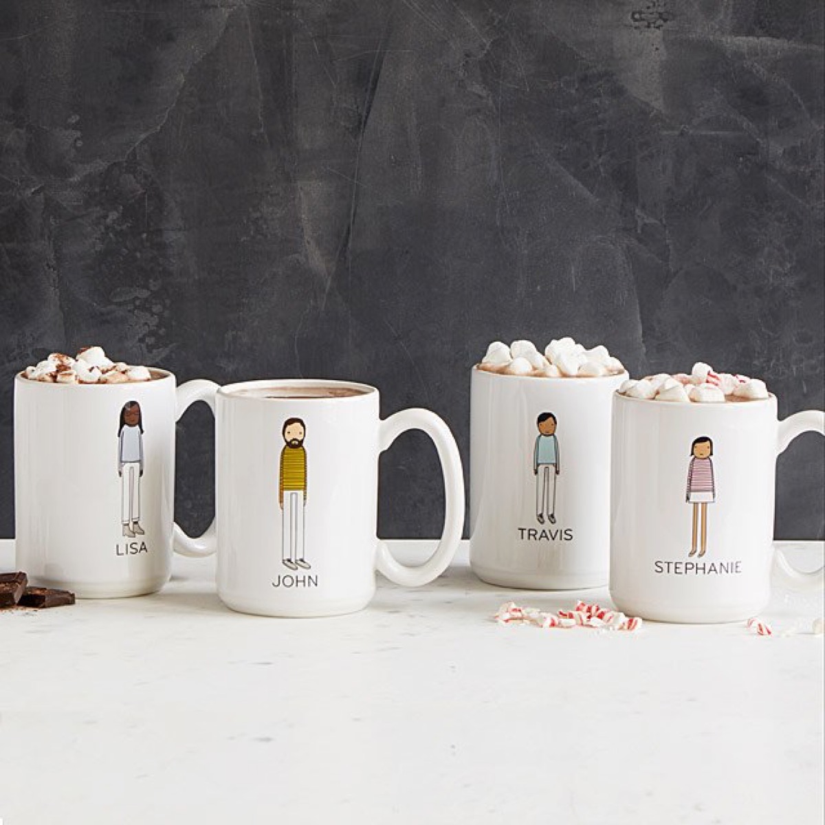 Four family member mugs with hot chocolate