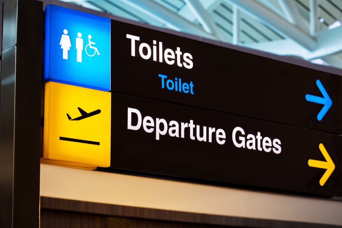 toilet and departure sign at airport