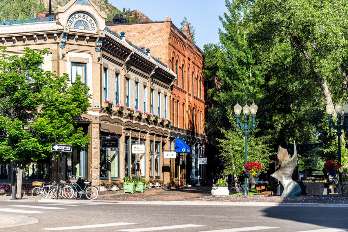 Town in Colorado with vintage architecture on street park square in luxury expensive famous city during summer day