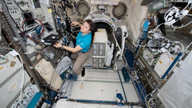 NASA astronaut Anne McClain works inside the Japanese Kibo laboratory aboard the International Space Station January 30, 2019 in Earth Orbit