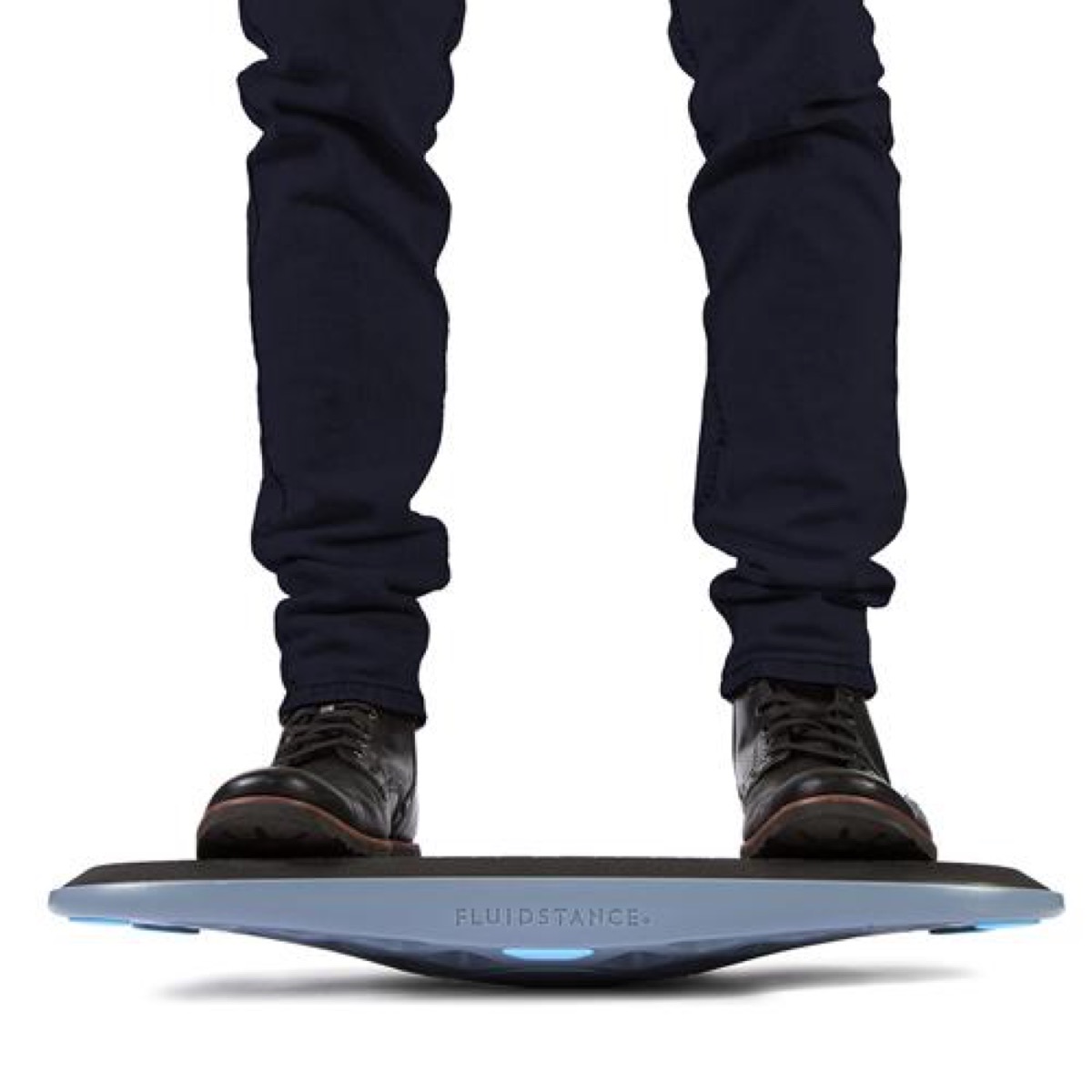 man in black pants on balance board