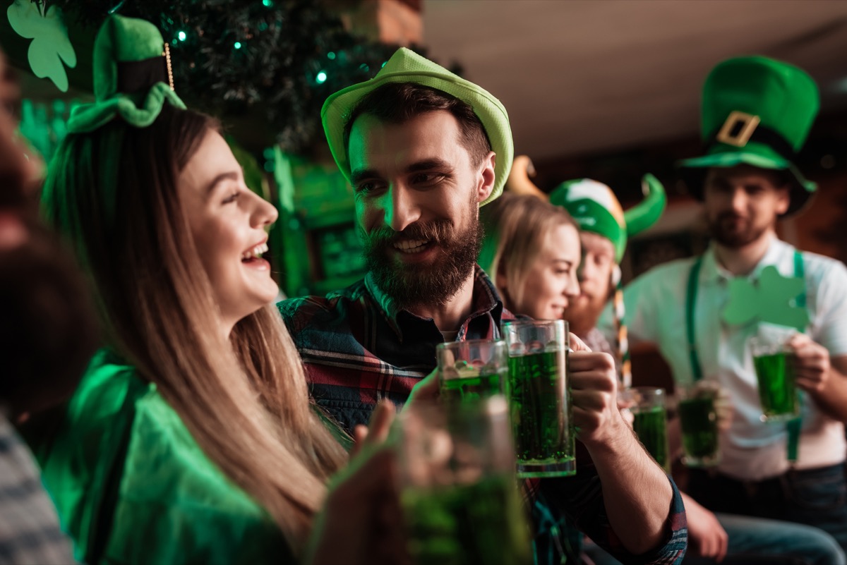 young people celebrating st. patrick's day in a bar
