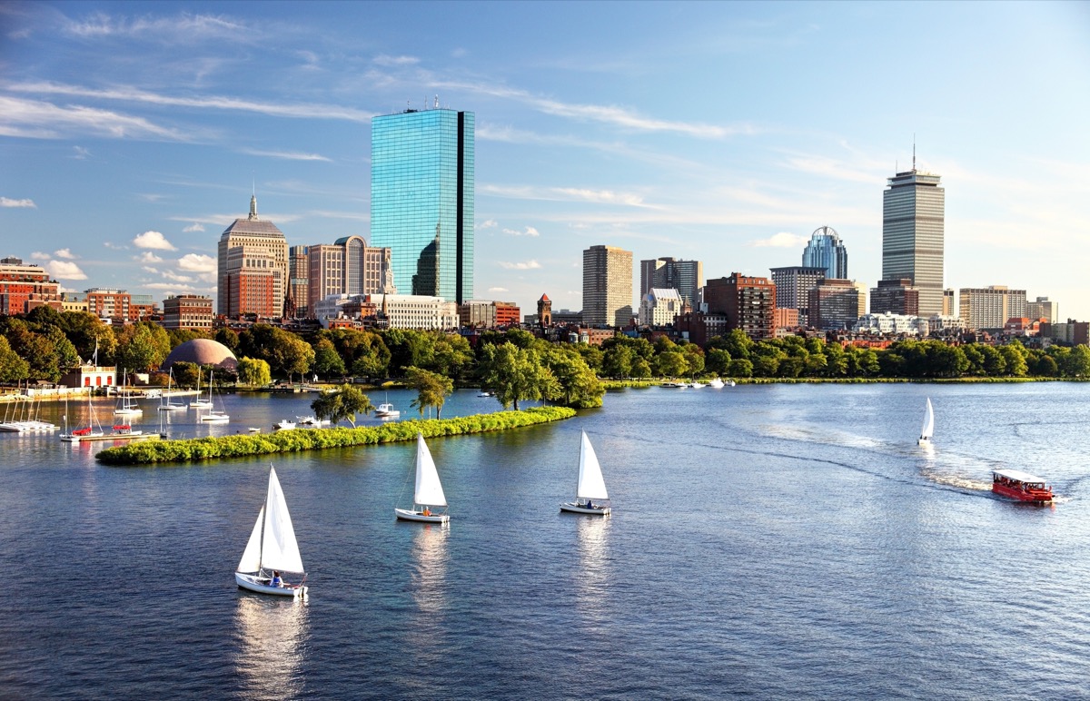 Sailboats on the Charles River with Boston's Back Bay skyline in the background.