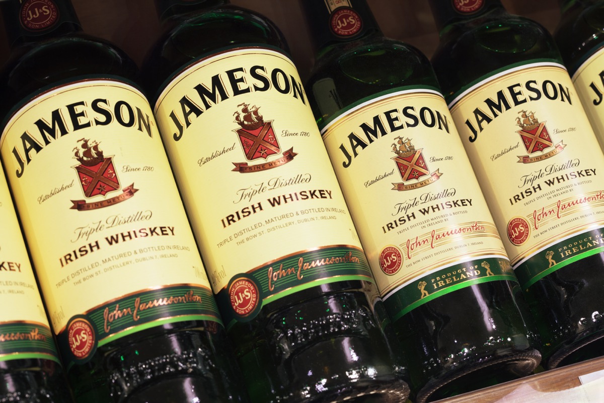 closeup of various bottle of Jameson Irish Whiskey in market