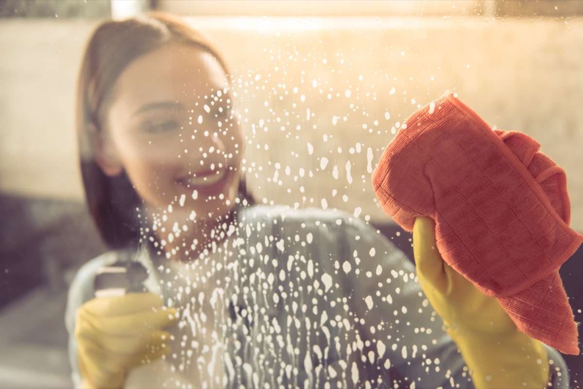 Woman cleaning a shower