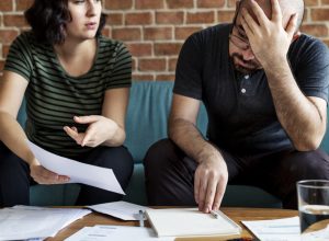 couple looking at paperwork with fine