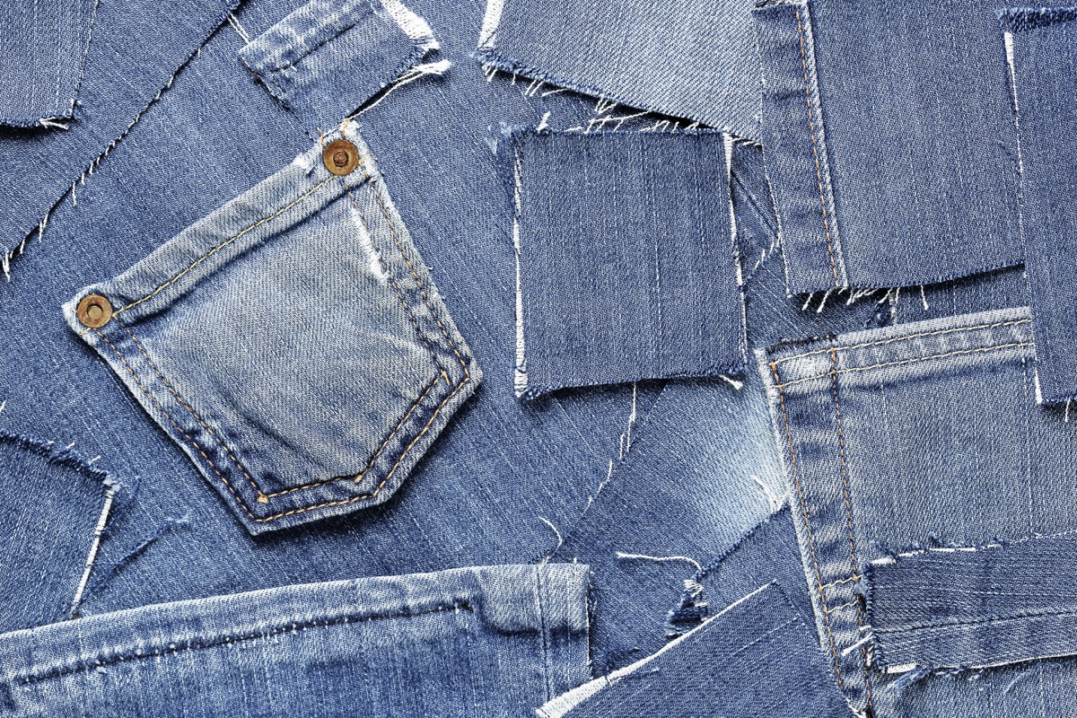 cut and torn patches of blue denim, fashion background