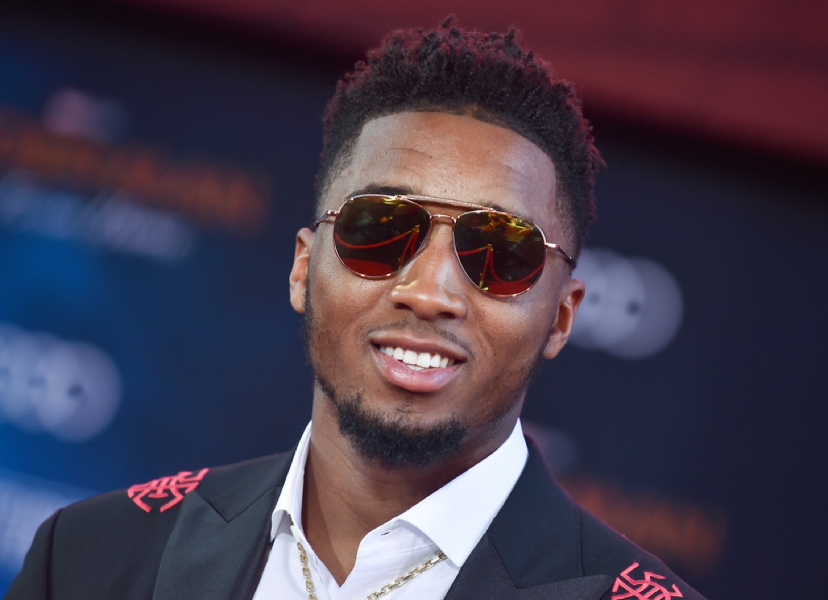 utah jazz player donovan mitchell in sunglasses and a suit