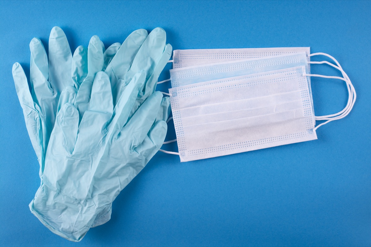 Medical bandages and gloves on a blue background.