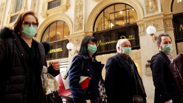 italians wear face masks amid coronavirus outbreak