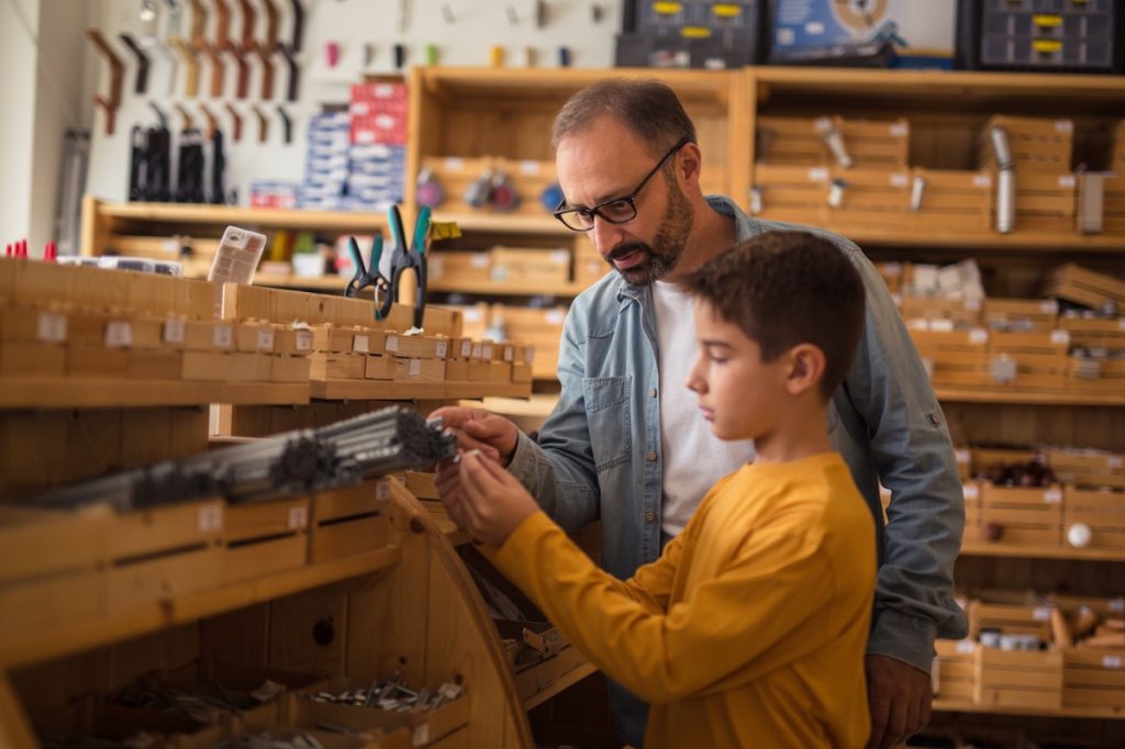 Photo of father and son in hardware store